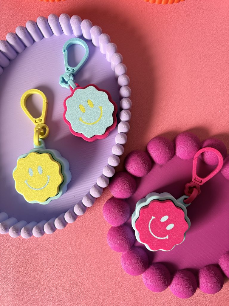 Clicker Smiley fleur mousqueton